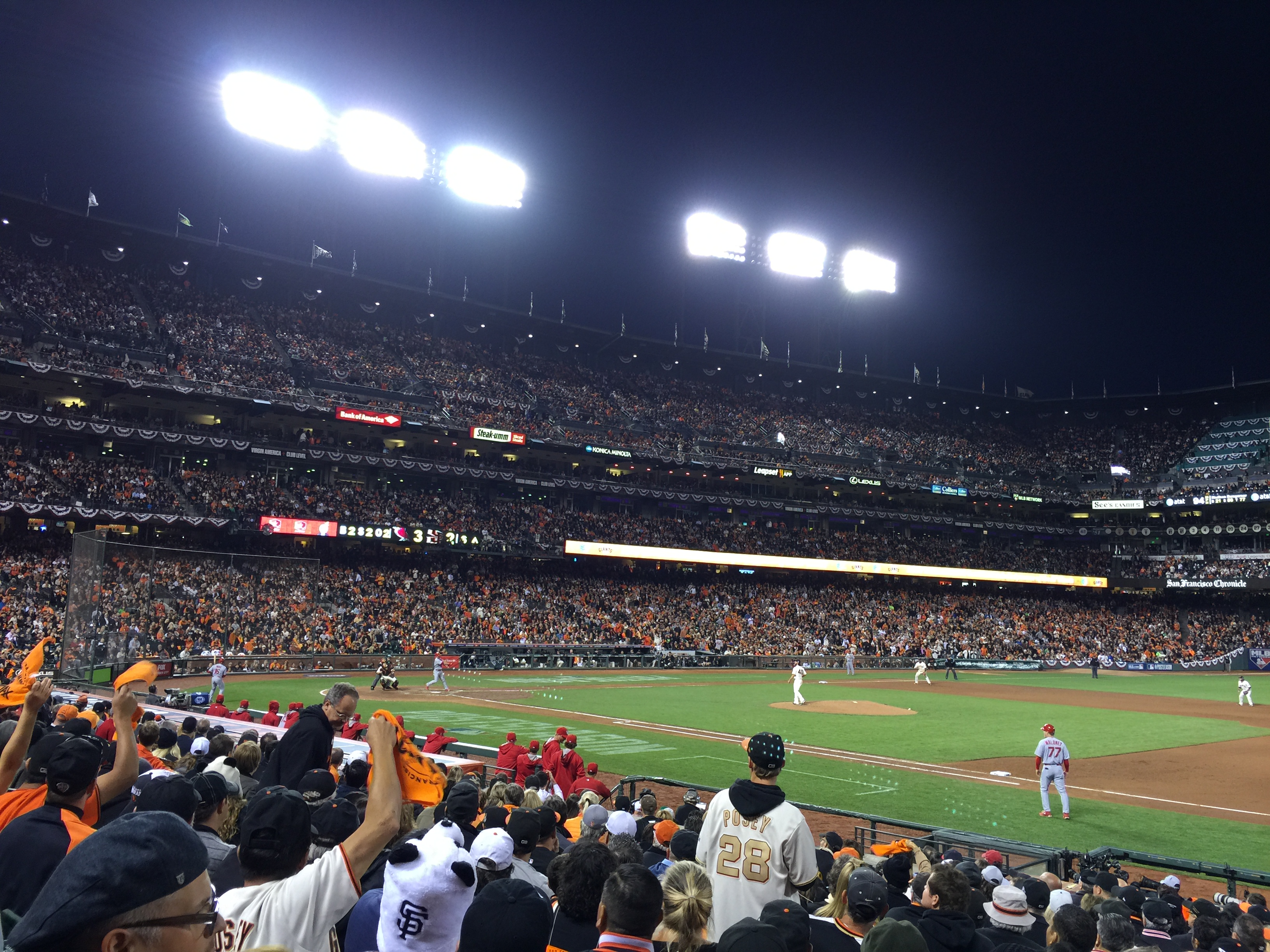 Fans gathered in a sports bar watching a live game.